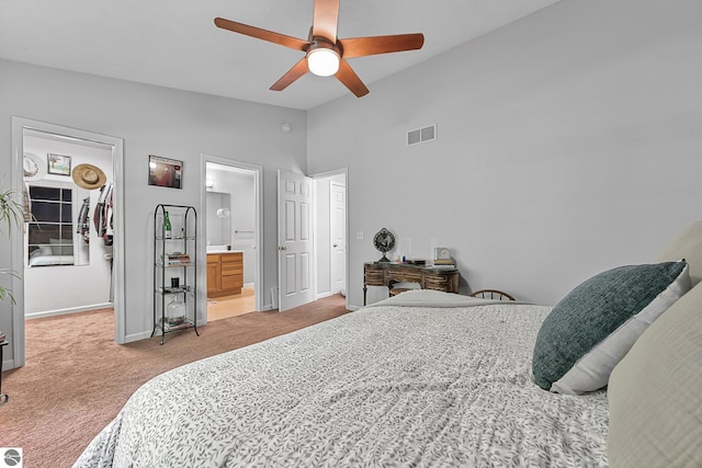 4667 Arbor Latch, Traverse City, MI 49685 - bedroom with light colored carpet, a walk in closet, baseboards, a ceiling fan, and a closet