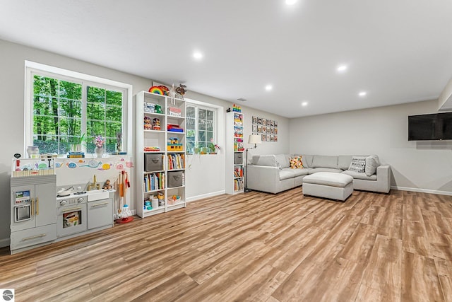 4667 Arbor Latch, Traverse City, MI 49685 - living room with light wood-type flooring, baseboards, and recessed lighting