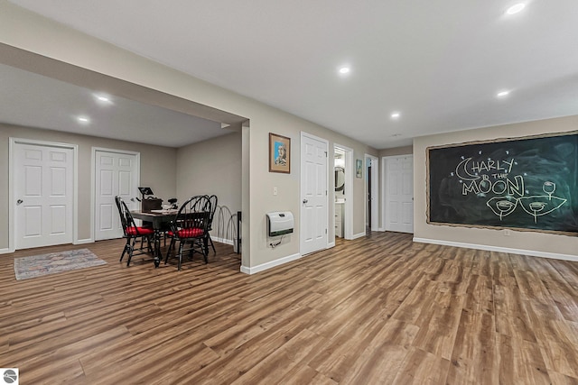 4667 Arbor Latch, Traverse City, MI 49685 - dining space featuring wood finished floors, baseboards, recessed lighting, and heating unit