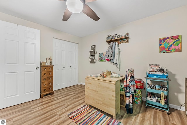 4667 Arbor Latch, Traverse City, MI 49685 - bedroom with wood finished floors, a closet, baseboards, and a ceiling fan