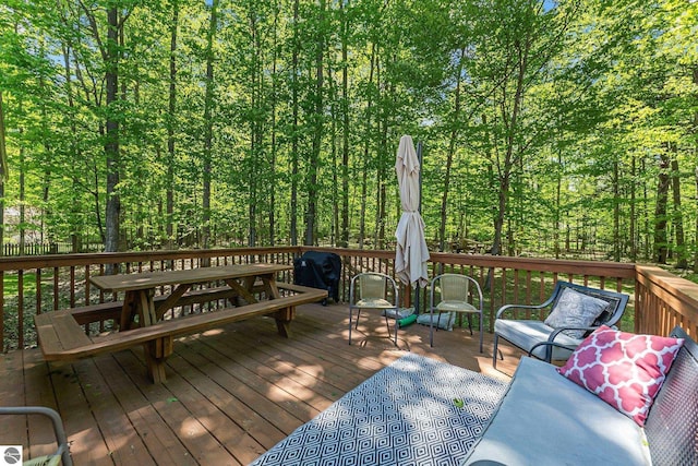 4667 Arbor Latch, Traverse City, MI 49685 - wooden deck featuring a grill and an outdoor hangout area