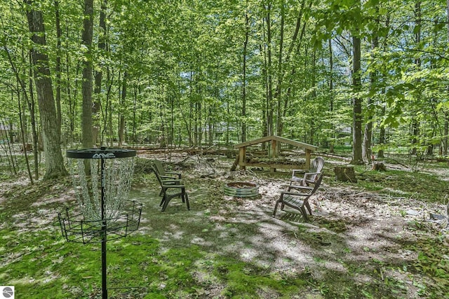 4667 Arbor Latch, Traverse City, MI 49685 - view of yard with an outdoor fire pit