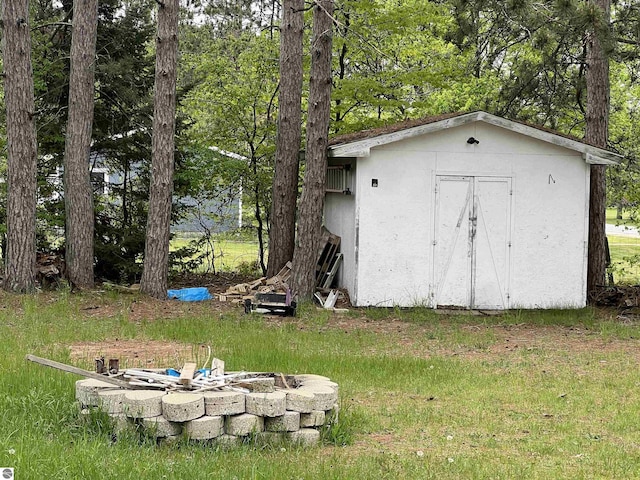6993 E 34th Rd, Cadillac, MI 49601 - view of shed with a fire pit