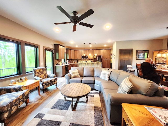 6238 E Gallivan Rd, Cedar, MI 49621 - living room featuring ceiling fan, light wood-style floors, and recessed lighting
