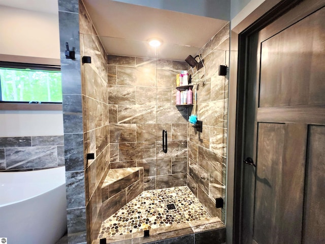 6238 E Gallivan Rd, Cedar, MI 49621 - full bathroom with a stall shower and a soaking tub