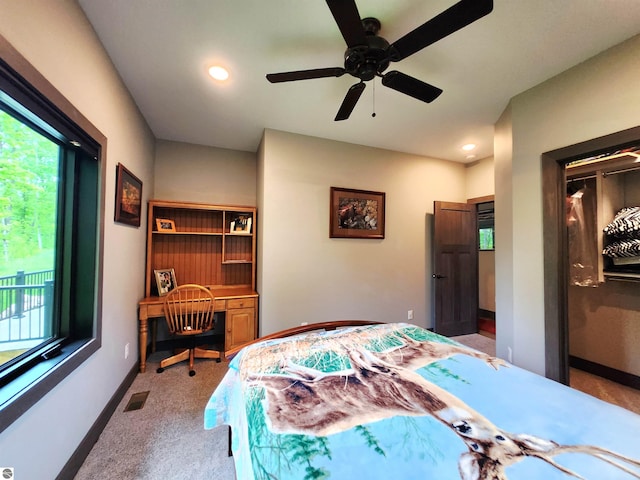 6238 E Gallivan Rd, Cedar, MI 49621 - bedroom with carpet floors, multiple windows, recessed lighting, an office area, and a ceiling fan