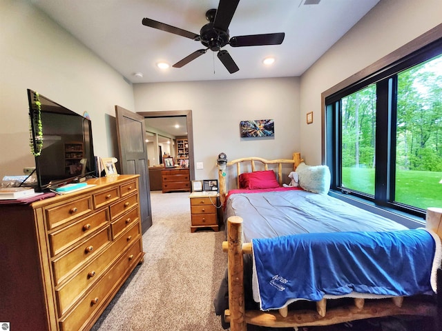 6238 E Gallivan Rd, Cedar, MI 49621 - bedroom with light colored carpet, recessed lighting, and ceiling fan