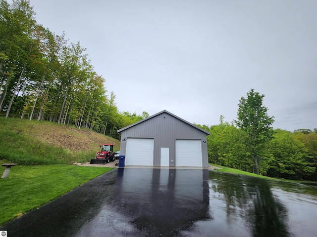 6238 E Gallivan Rd, Cedar, MI 49621 - detached garage with a forest view