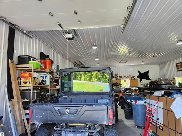 6238 E Gallivan Rd, Cedar, MI 49621 - garage featuring a garage door opener