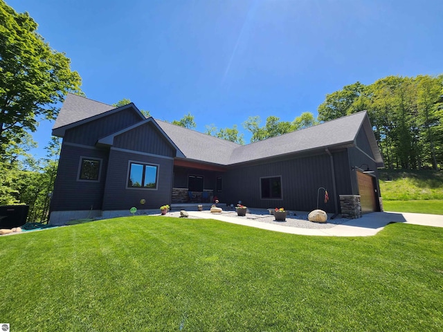 6238 E Gallivan Rd, Cedar, MI 49621 - back of property featuring a lawn and roof with shingles
