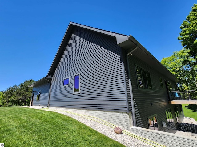 6238 E Gallivan Rd, Cedar, MI 49621 - view of property exterior featuring a lawn