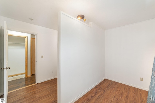 10745 W Remick Rd, Blanchard, MI 49310 - unfurnished room with wood finished floors and baseboards