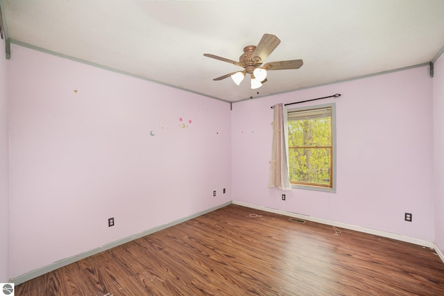 10745 W Remick Rd, Blanchard, MI 49310 - spare room with wood finished floors, ceiling fan, and baseboards