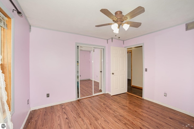 10745 W Remick Rd, Blanchard, MI 49310 - unfurnished bedroom with light wood-type flooring, baseboards, a ceiling fan, and a closet