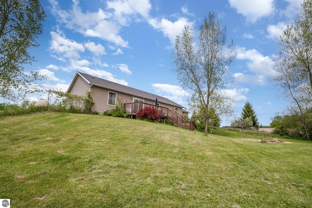 10745 W Remick Rd, Blanchard, MI 49310 - view of green lawn with a deck