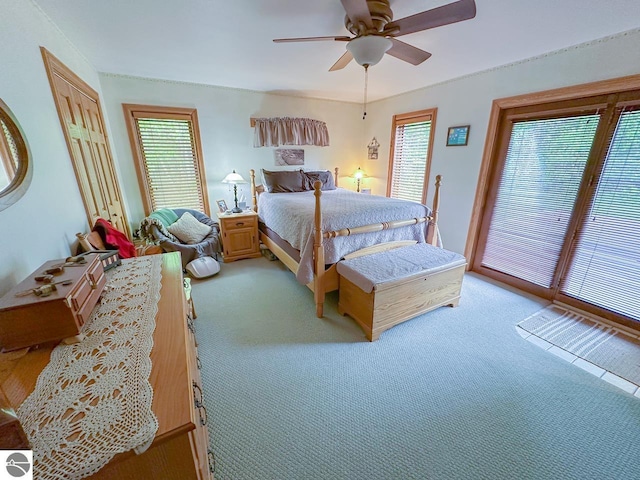 4809 N Alamando Rd, Coleman, MI 48618 - bedroom with light colored carpet, multiple windows, and a ceiling fan