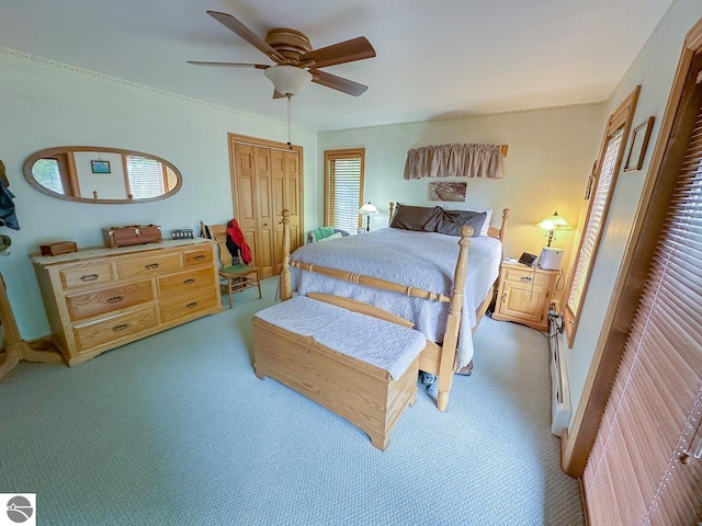 4809 N Alamando Rd, Coleman, MI 48618 - carpeted bedroom with a ceiling fan, a closet, and baseboards