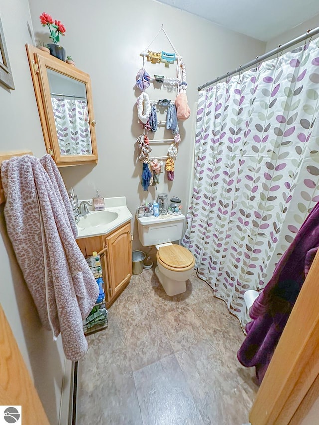 4809 N Alamando Rd, Coleman, MI 48618 - bathroom with toilet, vanity, and a shower with curtain