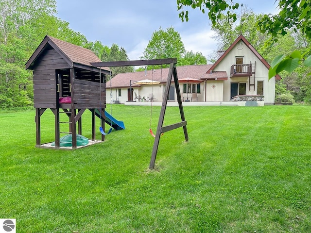 4809 N Alamando Rd, Coleman, MI 48618 - view of jungle gym with a yard