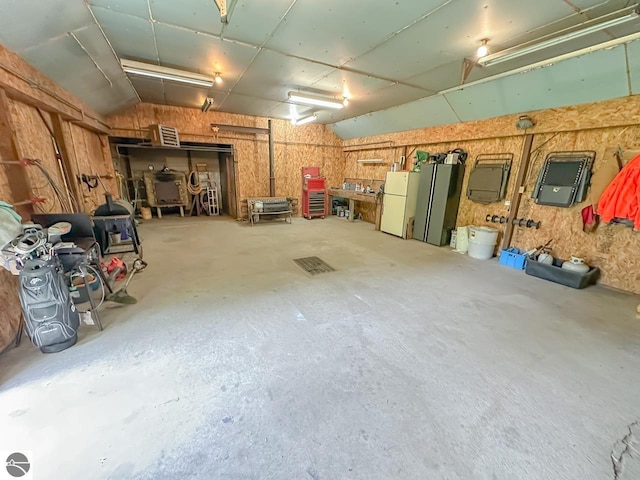 4809 N Alamando Rd, Coleman, MI 48618 - garage featuring freestanding refrigerator