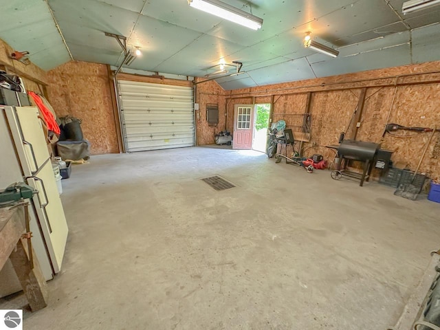 4809 N Alamando Rd, Coleman, MI 48618 - garage featuring freestanding refrigerator