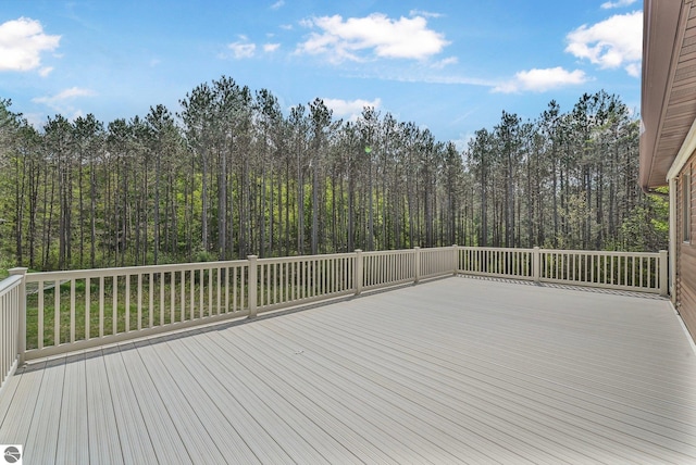 2460 E 26th Rd, Cadillac, MI 49601 - wooden deck with a forest view