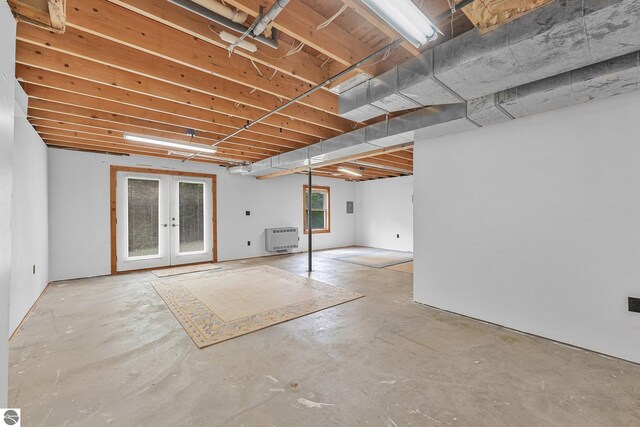 2460 E 26th Rd, Cadillac, MI 49601 - basement with heating unit and french doors