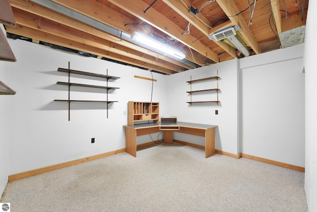 2460 E 26th Rd, Cadillac, MI 49601 - below grade area featuring light carpet and baseboards