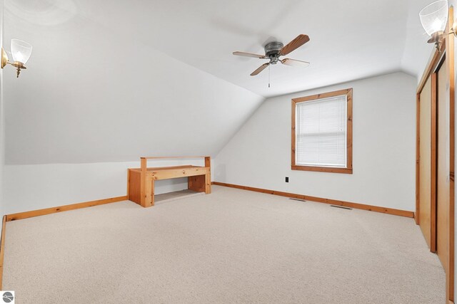 2460 E 26th Rd, Cadillac, MI 49601 - bonus room with vaulted ceiling, light colored carpet, baseboards, and ceiling fan
