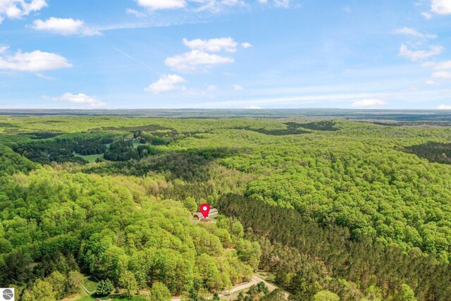 2460 E 26th Rd, Cadillac, MI 49601 - aerial view of property and surrounding area featuring a heavily wooded area