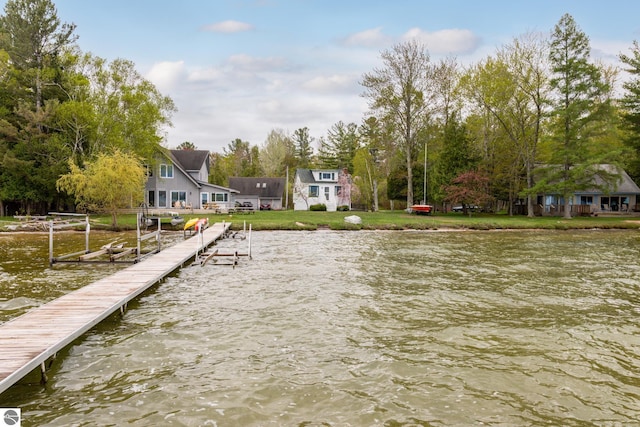 5434 W Macfarlane Rd, Glen Arbor, MI 49636 - dock area with a water view and a yard