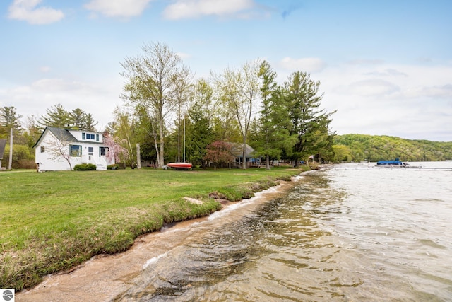 5434 W Macfarlane Rd, Glen Arbor, MI 49636 - view of green lawn featuring a water view
