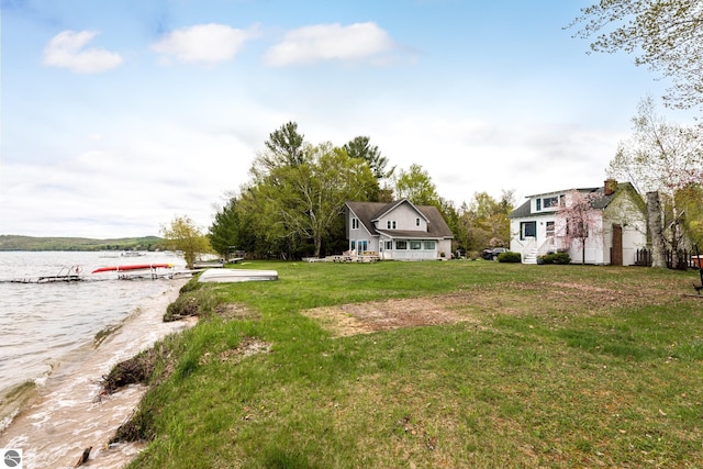 5434 W Macfarlane Rd, Glen Arbor, MI 49636 - view of green lawn with a water view