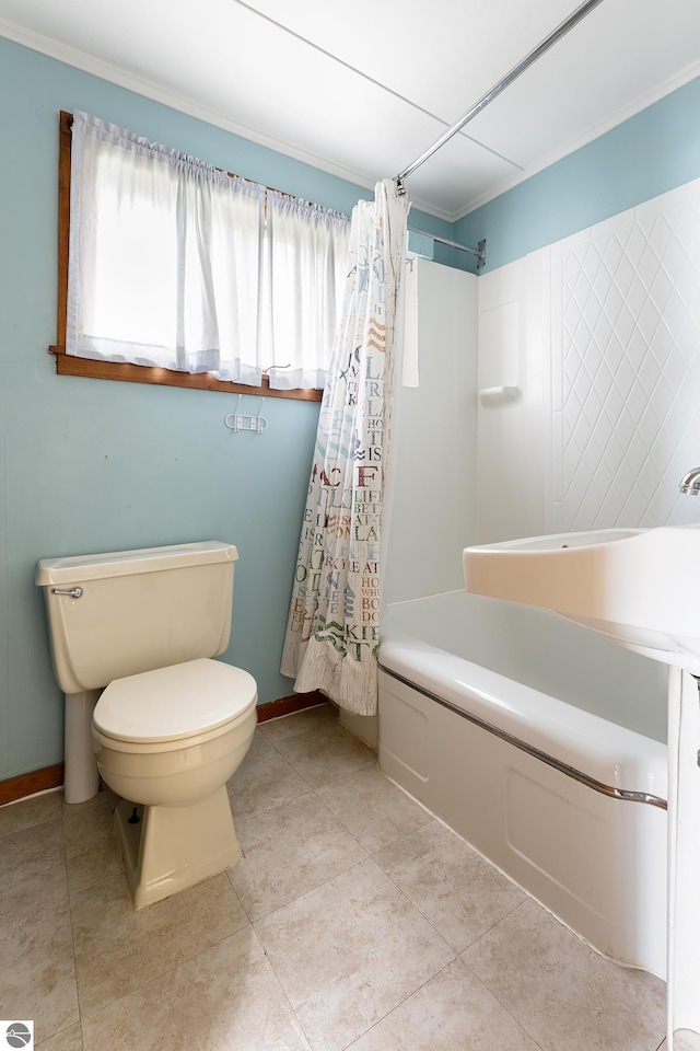 5434 W Macfarlane Rd, Glen Arbor, MI 49636 - bathroom featuring toilet, shower / bath combo with shower curtain, baseboards, crown molding, and tile patterned floors