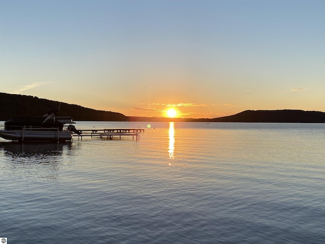 5434 W Macfarlane Rd, Glen Arbor, MI 49636 - water view with a dock and mountains