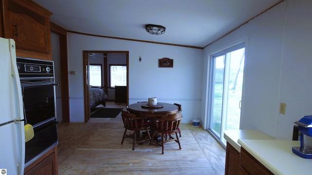 120 Lorna Ln, Roscommon, MI 48653 - dining space with light wood-type flooring and ornamental molding