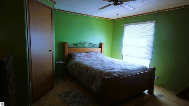 120 Lorna Ln, Roscommon, MI 48653 - bedroom with ornamental molding, a textured ceiling, a ceiling fan, and light wood finished floors