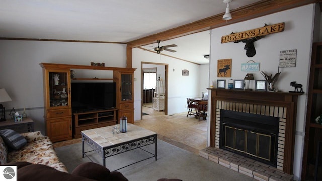 120 Lorna Ln, Roscommon, MI 48653 - living area with vaulted ceiling, ceiling fan, ornamental molding, a fireplace, and carpet floors