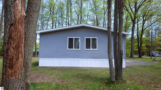 120 Lorna Ln, Roscommon, MI 48653 - view of side of property with a lawn
