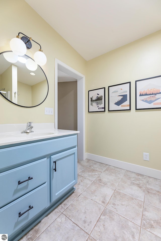 1281 River Rd, Beulah, MI 49617 - bathroom featuring vanity, baseboards, and tile patterned floors