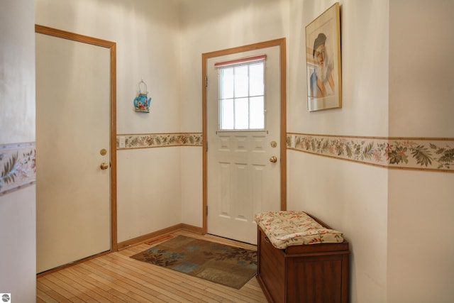 1162 Hemingway Ln, Traverse City, MI 49686 - doorway to outside with hardwood / wood-style floors