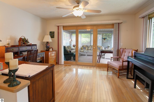 1162 Hemingway Ln, Traverse City, MI 49686 - home office with light wood-type flooring, a ceiling fan, and french doors