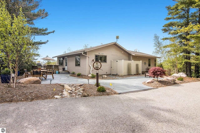 11896 Cabana Shores Rd, Williamsburg, MI 49690 - ranch-style home with a patio area