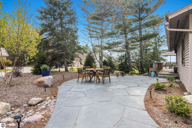 11896 Cabana Shores Rd, Williamsburg, MI 49690 - view of patio / terrace featuring outdoor dining space and a deck