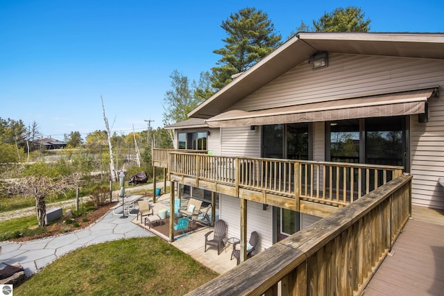 11896 Cabana Shores Rd, Williamsburg, MI 49690 - wooden terrace featuring a patio area