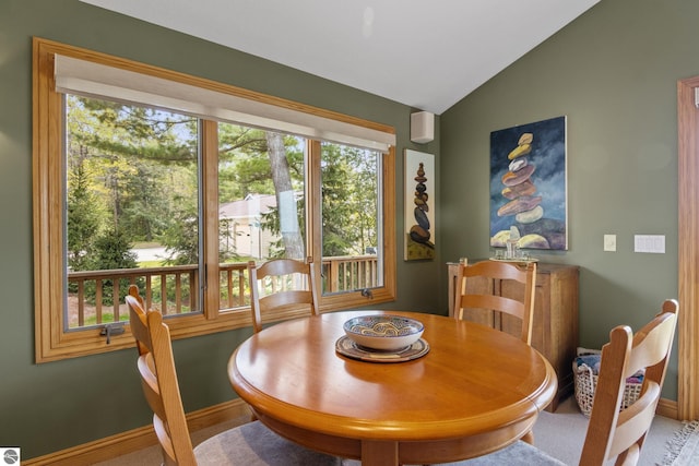 11896 Cabana Shores Rd, Williamsburg, MI 49690 - dining room featuring lofted ceiling and baseboards