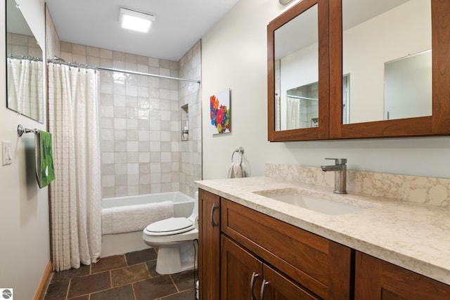 11896 Cabana Shores Rd, Williamsburg, MI 49690 - bathroom featuring vanity, shower / tub combo, toilet, stone finish floors, and baseboards