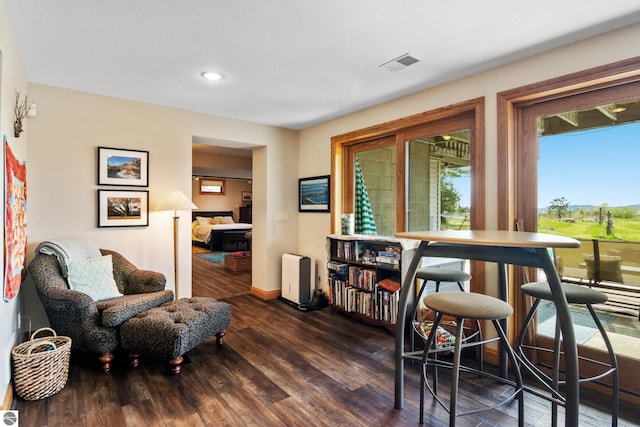 11896 Cabana Shores Rd, Williamsburg, MI 49690 - sitting room with wood finished floors, baseboards, and recessed lighting