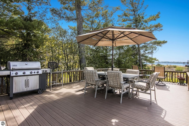 11896 Cabana Shores Rd, Williamsburg, MI 49690 - deck with outdoor dining area and grilling area