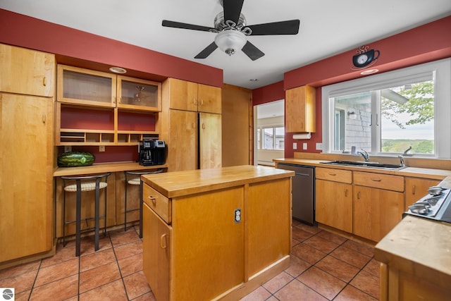 6675 Walker St, Benzonia, MI 49616 - kitchen with stainless steel dishwasher, butcher block countertops, a center island, and healthy amount of natural light